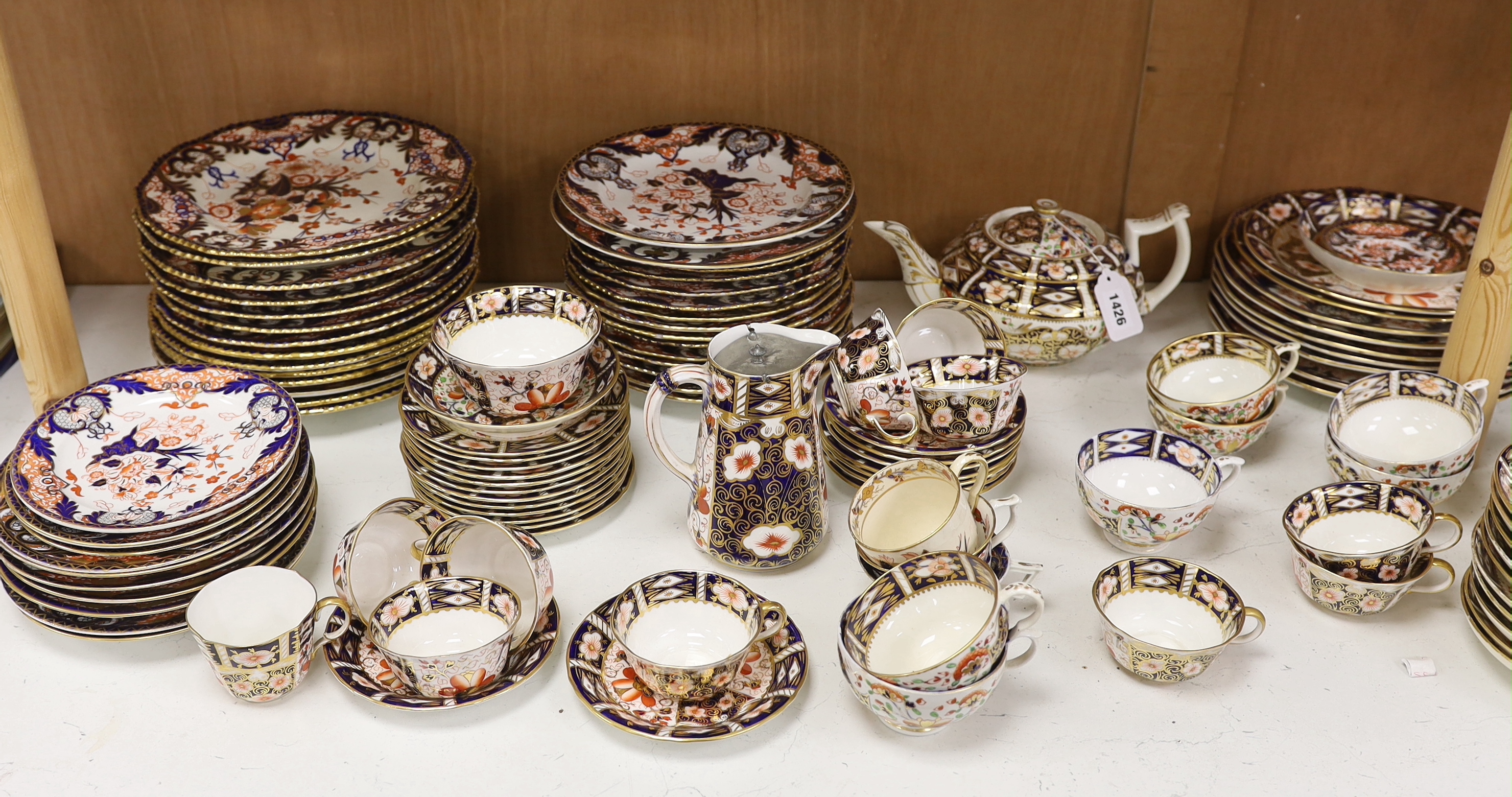 A Collection of Bloor period to Royal Crown Derby Imari pattern dinner and tea ware including dinner plates, cup and saucers and jugs, etc. largest 26cm in diameter